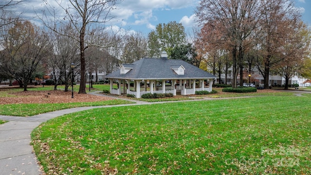 view of front of house with a porch and a front yard