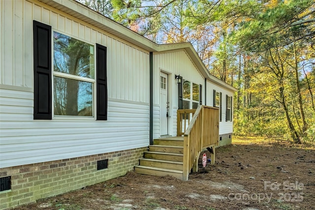 view of side of property with crawl space