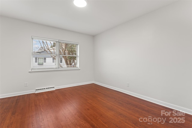 empty room with wood-type flooring