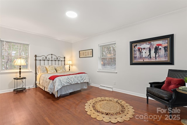 bedroom featuring ornamental molding and dark hardwood / wood-style floors