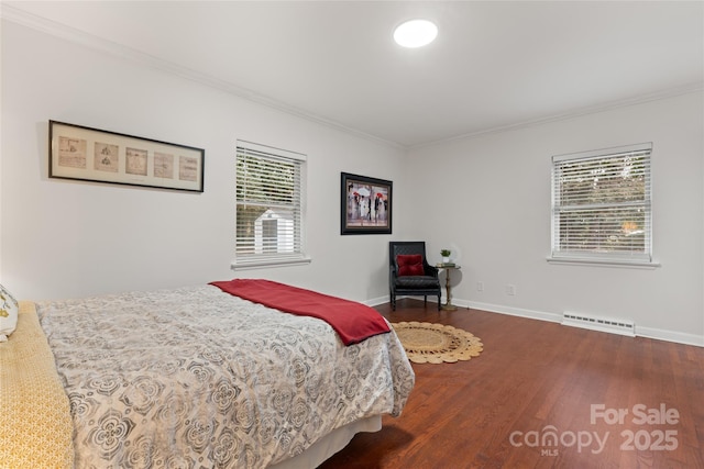 bedroom featuring ornamental molding and dark wood-type flooring