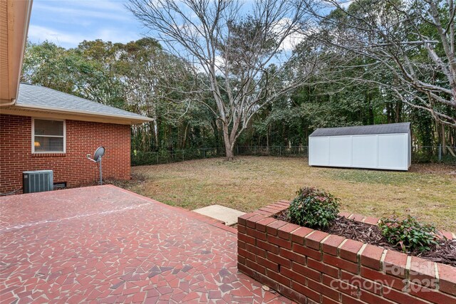 view of patio / terrace featuring a shed and central air condition unit