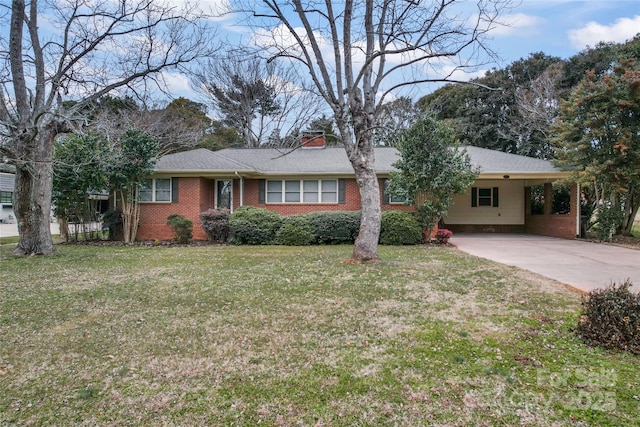 single story home featuring a front lawn and a carport