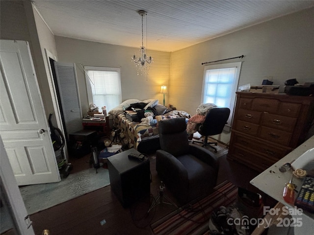 interior space featuring a notable chandelier and wood-type flooring