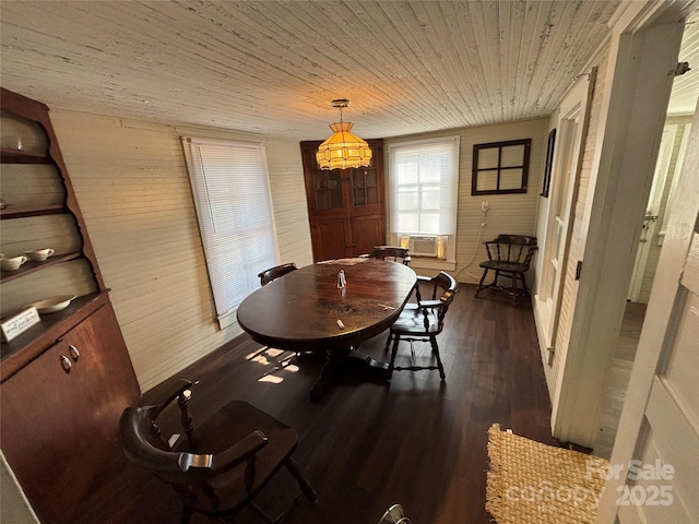 dining space with dark hardwood / wood-style flooring, cooling unit, and wooden ceiling