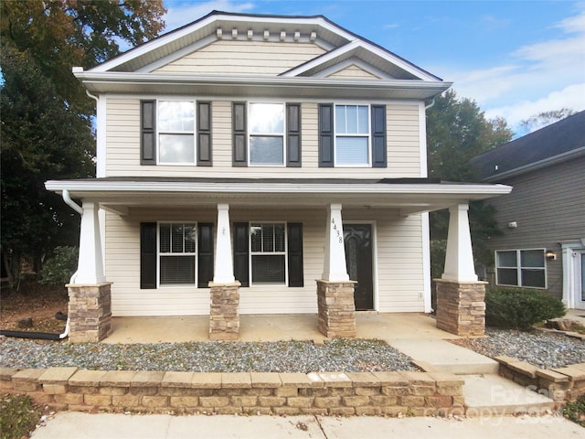 craftsman inspired home featuring covered porch