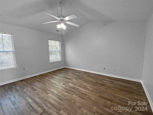 unfurnished room with dark hardwood / wood-style flooring, ceiling fan, plenty of natural light, and lofted ceiling