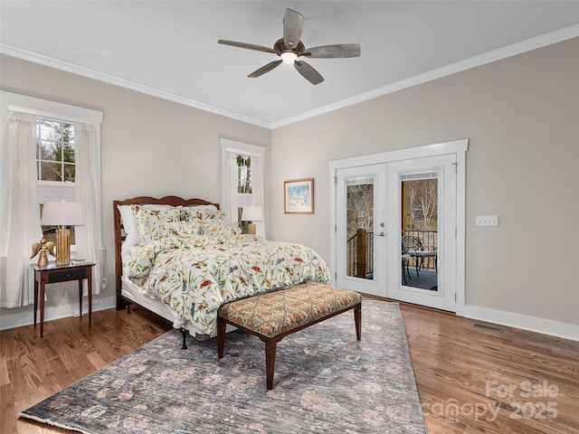 bedroom featuring access to exterior, ornamental molding, wood finished floors, and french doors