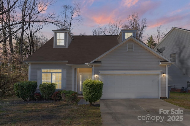 view of front facade with an attached garage and driveway