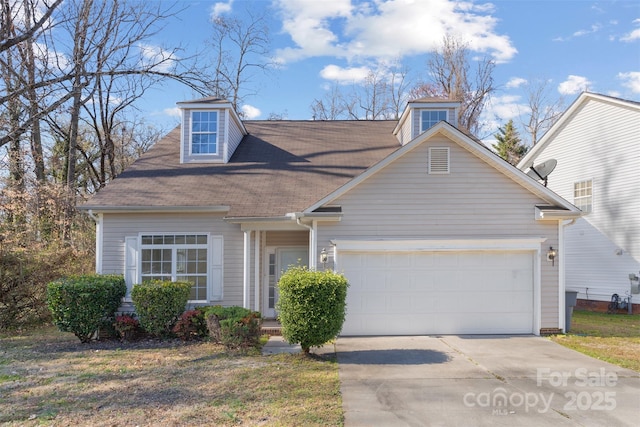 view of front of property featuring a garage and driveway