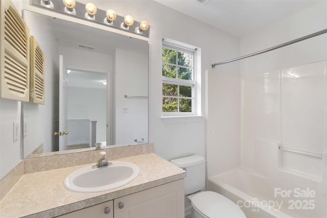 bathroom with vanity, toilet, bathtub / shower combination, and visible vents