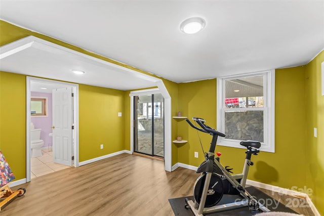 exercise area featuring light hardwood / wood-style flooring