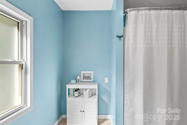 bathroom with tile patterned floors