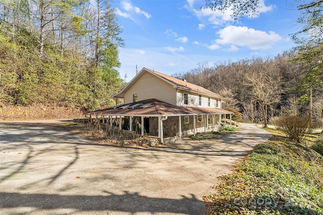 view of property exterior with a porch