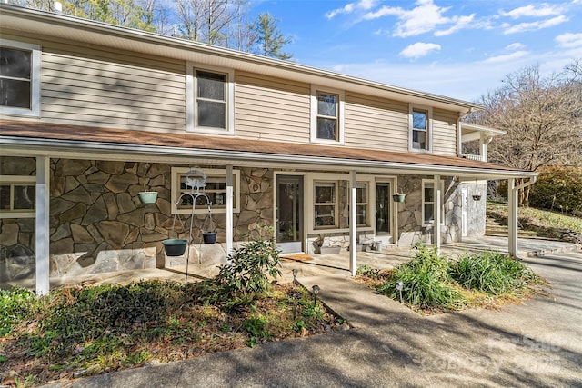 country-style home featuring a patio