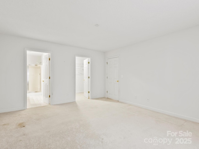 empty room with light colored carpet