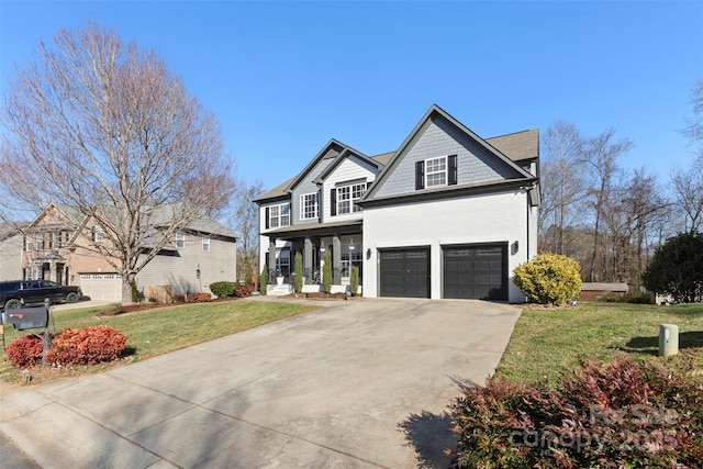 view of front of house with a garage, a front yard, and covered porch