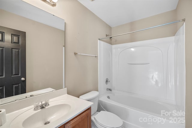 full bathroom featuring toilet, vanity, and shower / washtub combination