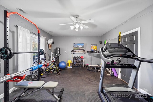 exercise room with ceiling fan