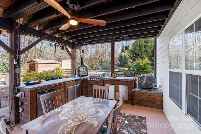 view of patio / terrace featuring ceiling fan, grilling area, and area for grilling