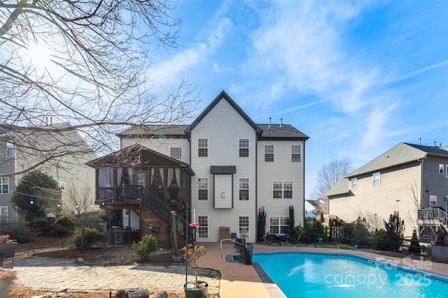 back of property featuring a patio and a gazebo