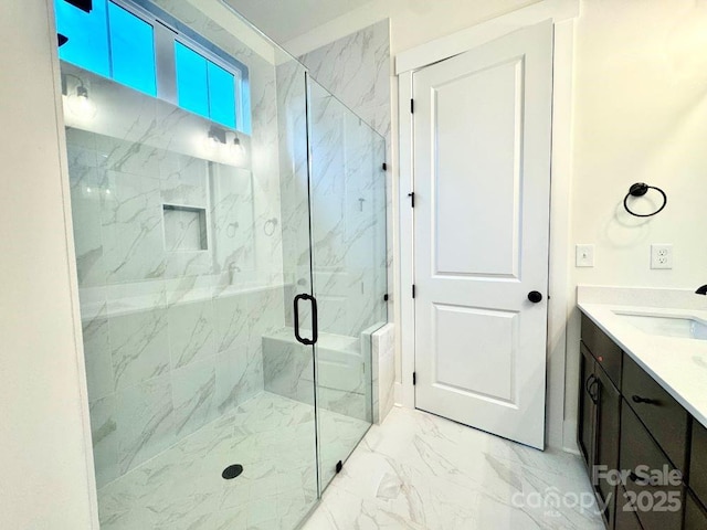 bathroom with vanity and an enclosed shower