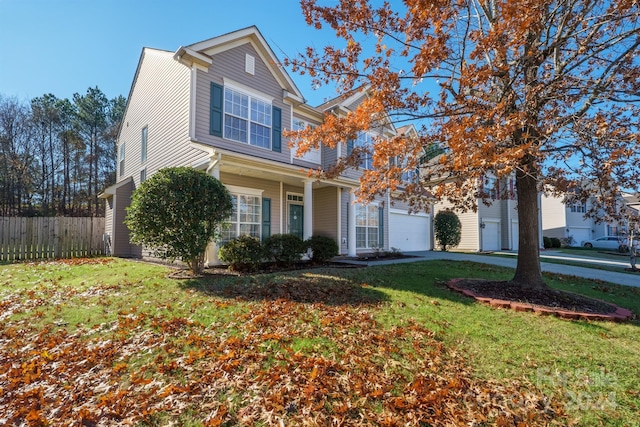 front of property featuring a garage and a front lawn