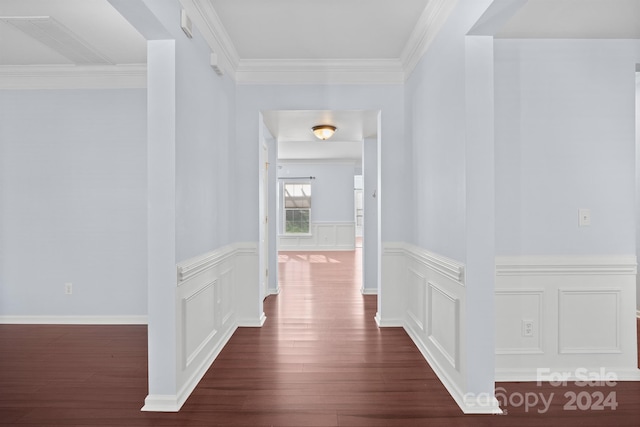 corridor featuring dark hardwood / wood-style flooring and crown molding