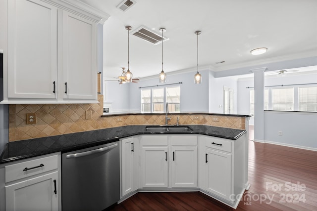 kitchen with white cabinets, sink, stainless steel dishwasher, dark hardwood / wood-style floors, and decorative light fixtures