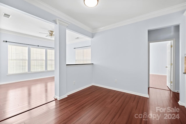 spare room featuring ceiling fan, ornamental molding, and hardwood / wood-style flooring