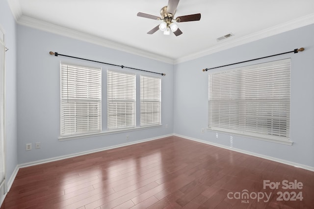 empty room with crown molding, ceiling fan, and hardwood / wood-style flooring