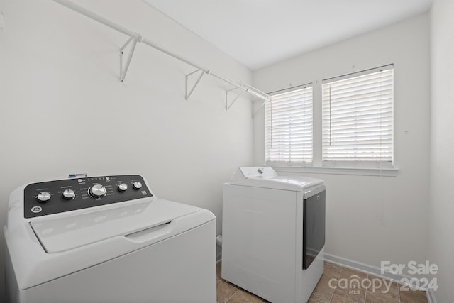 clothes washing area featuring washing machine and dryer