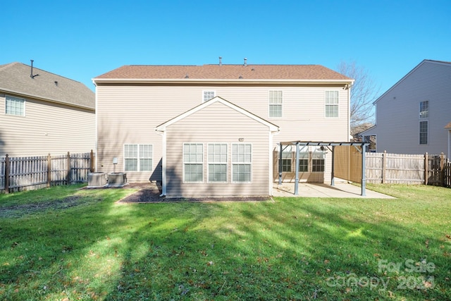 rear view of house with a patio area, a pergola, and a yard