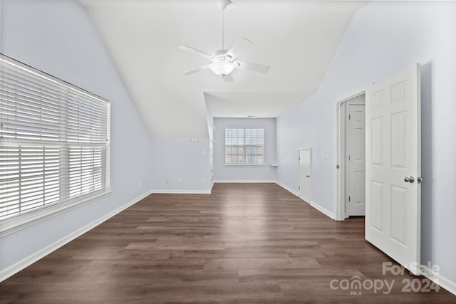 bonus room with lofted ceiling, ceiling fan, and dark wood-type flooring