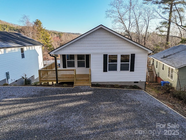 rear view of property with crawl space