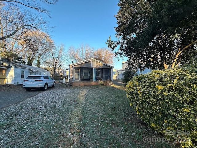 view of front of house with a sunroom