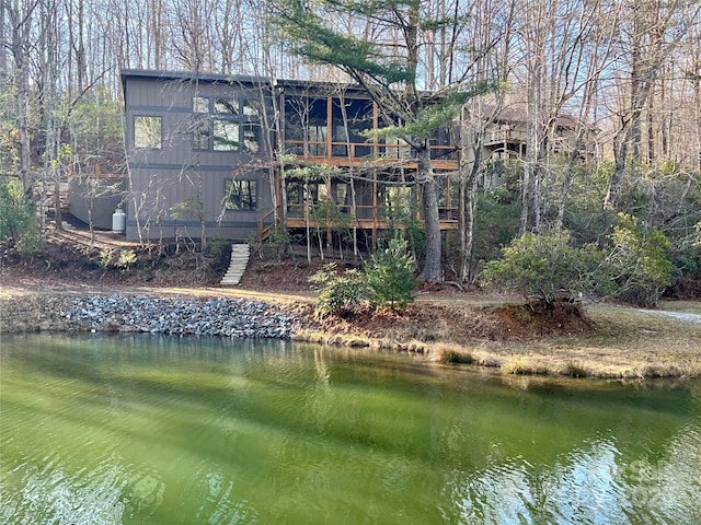 back of house featuring a water view