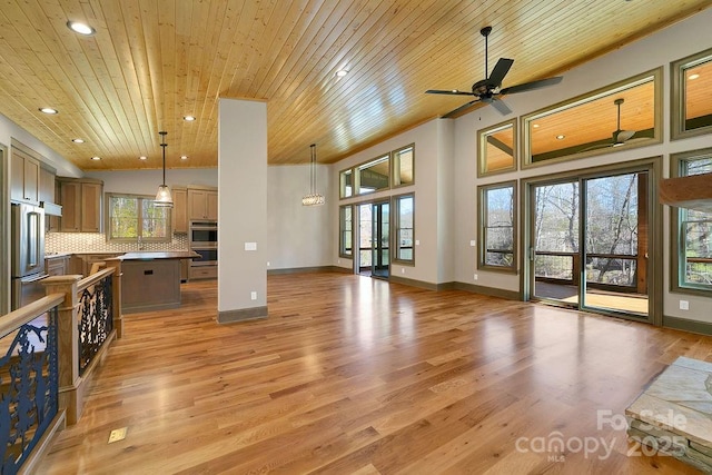 living area with wooden ceiling, light wood-style flooring, baseboards, and recessed lighting