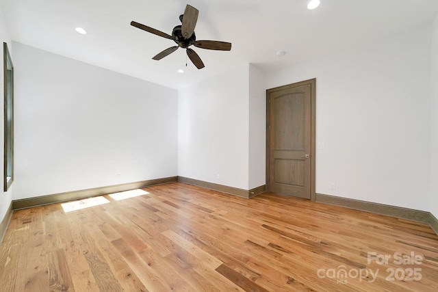 spare room with light wood-type flooring, baseboards, a ceiling fan, and recessed lighting