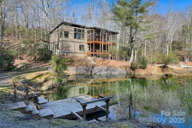 dock area with a water view