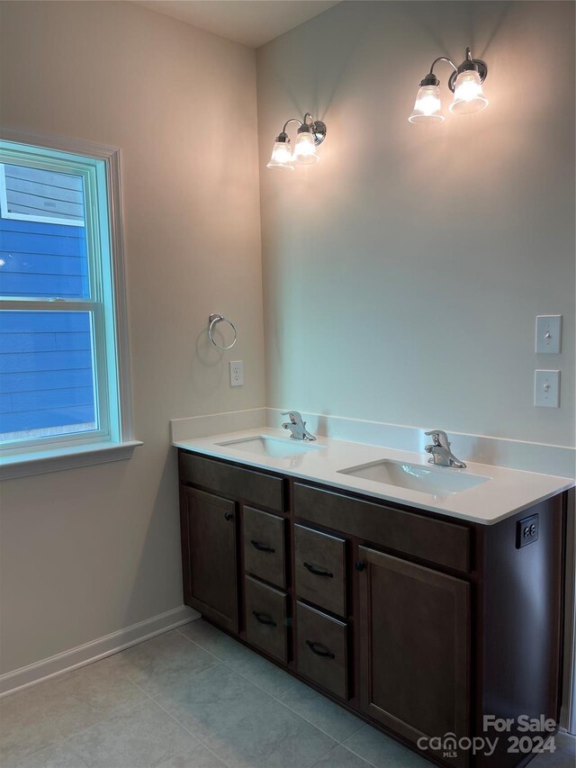 bathroom with tile patterned floors and vanity