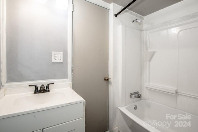 bathroom featuring shower / washtub combination and vanity