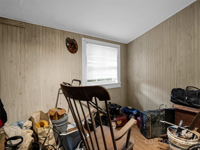 miscellaneous room with wood walls and wood-type flooring