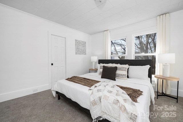 carpeted bedroom with ornamental molding