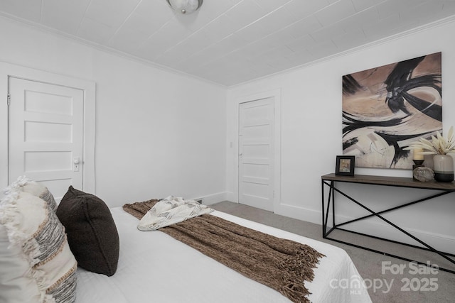 carpeted bedroom featuring ornamental molding