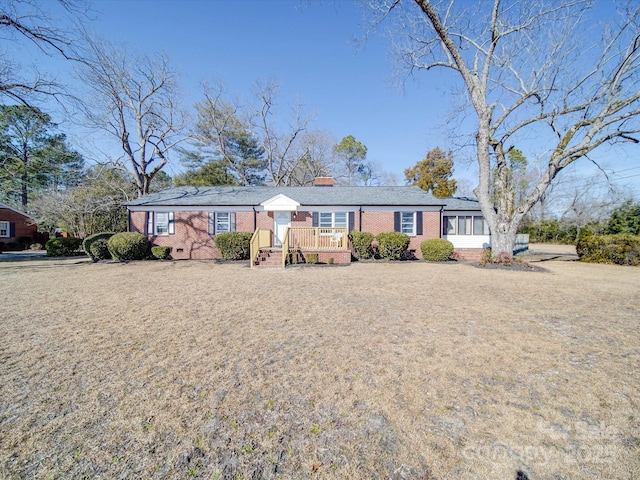 view of front of property with a wooden deck