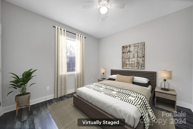 bedroom with ceiling fan and dark hardwood / wood-style flooring