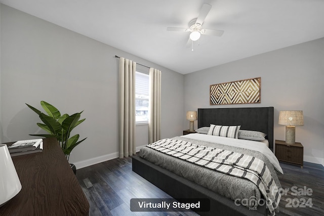 bedroom featuring dark hardwood / wood-style floors and ceiling fan