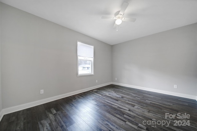 unfurnished room with ceiling fan and dark hardwood / wood-style floors