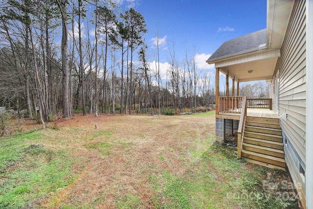 view of yard with a wooden deck